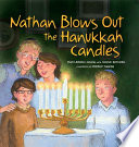 Nathan blows out the Hanukkah candles /